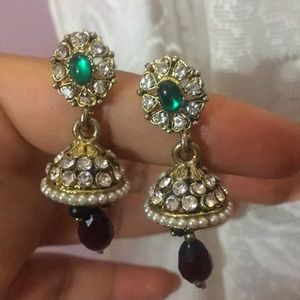 Pretty earrings with a dark green gem